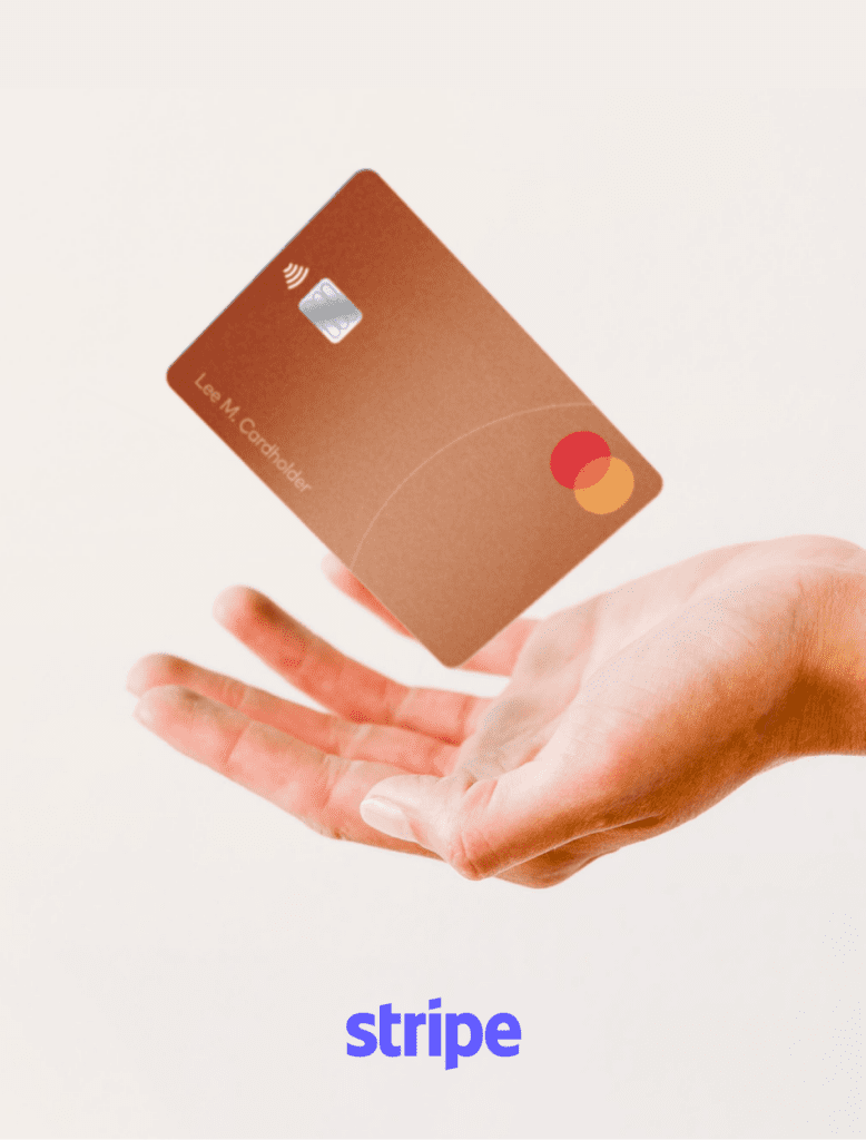 A close-up of an open hand with a bronze Mastercard credit card hovering just above the palm against a plain white background. The word "stripe" is written at the bottom in blue lowercase text.