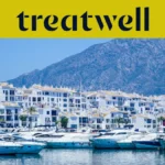 Puerto Banús marina in Marbella, lined with white apartment buildings and moored yachts against a mountain backdrop, beneath a yellow Treatwell banner.